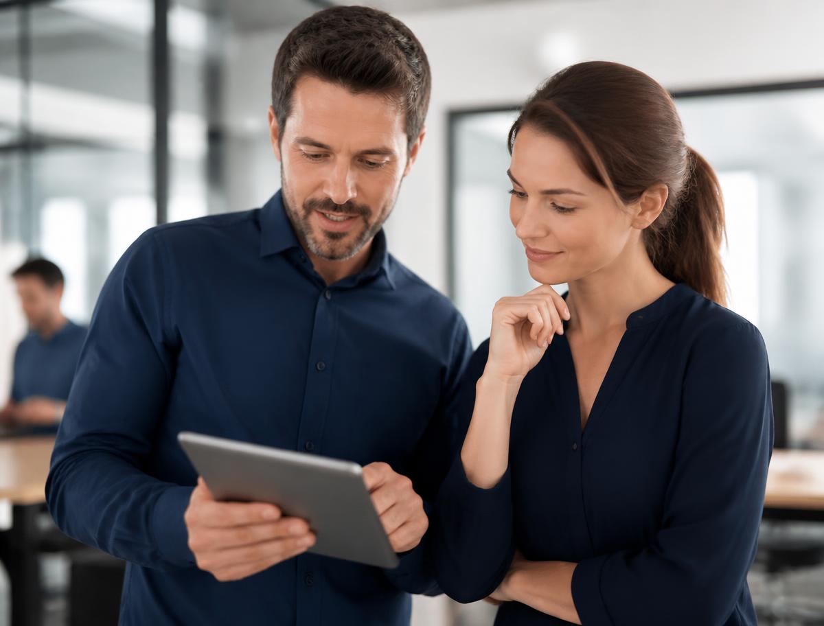 A manager and employee reviewing timekeeping practices